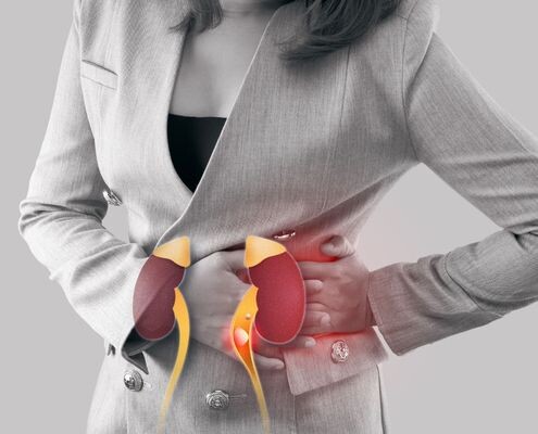 Businesswoman has chronic kidney disease, so her hand is on her left waist